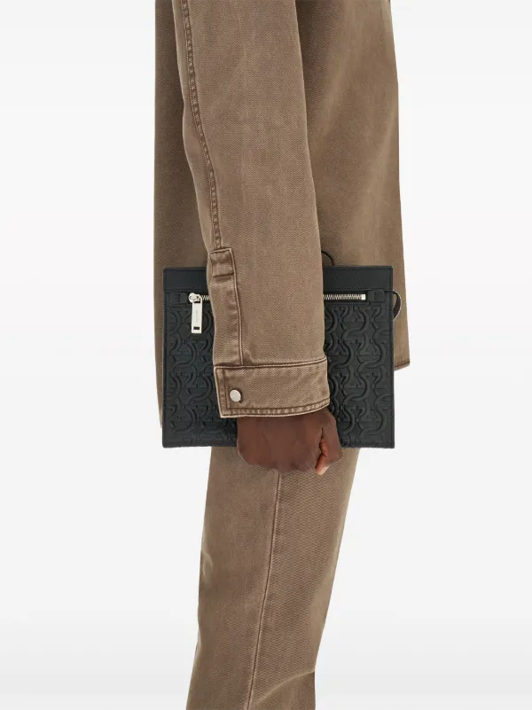 Ferragamo Gancini logo-embossed Clutch Bag | Black | FARFETCH