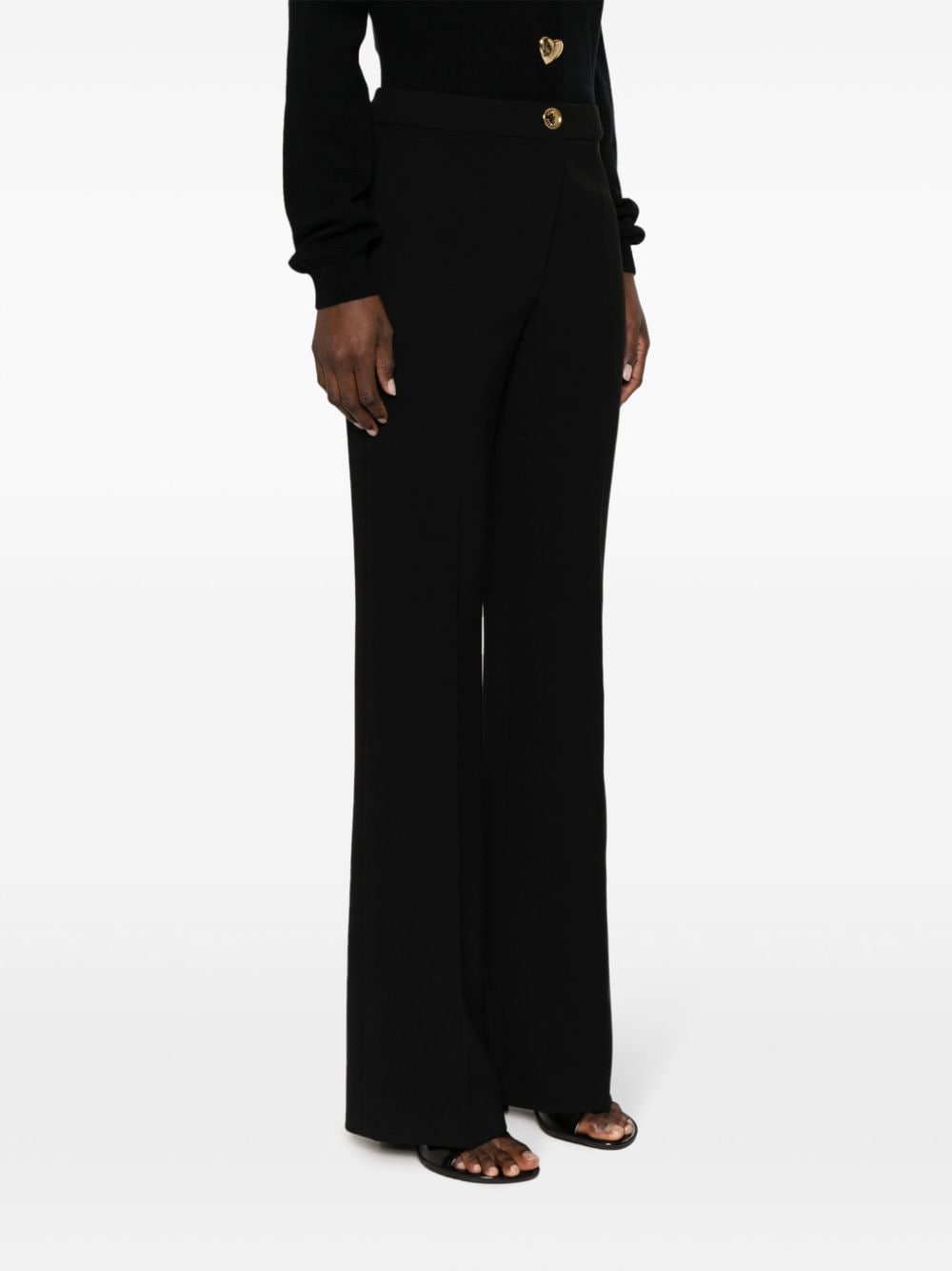 Shop Moschino Pressed-crease Button-fastening Tailored Trousers In Black