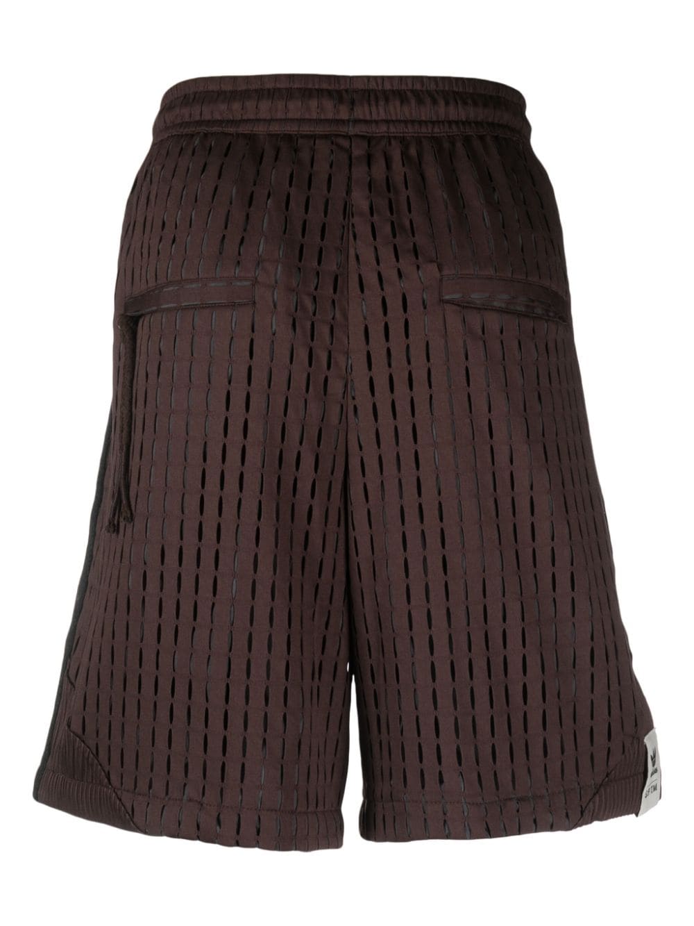 adidas x Song for the Mute shorts met logopatch Bruin