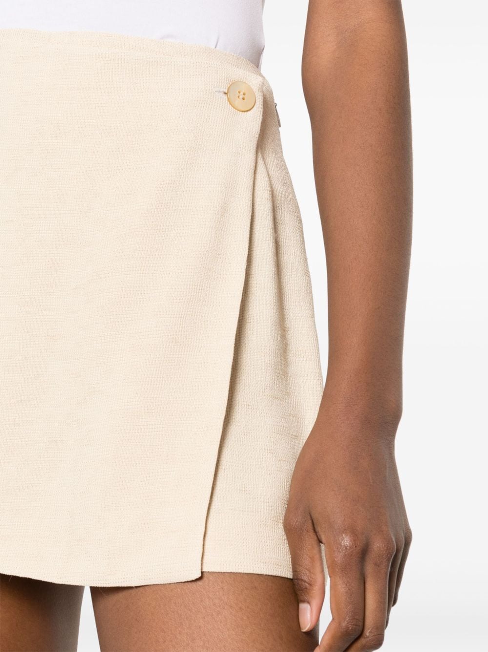 Shop Claudie Pierlot Wrap-design Textured Miniskirt In Nude