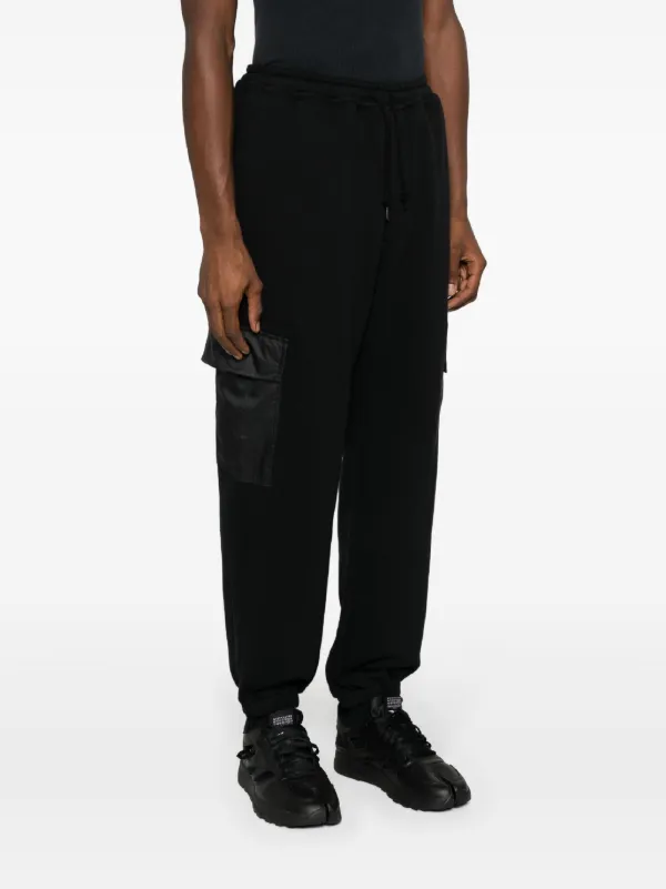 パンツ COMME des GARCONS HOMME trackpants Comme Des Garçons Homme logo-print Track Pants | Black
