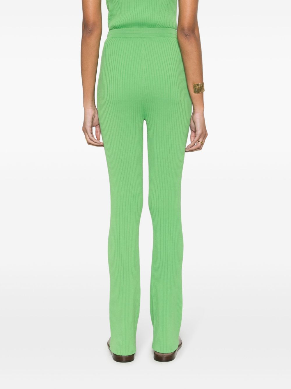 Shop Nanushka Cornelie Ribbed-knit Flared Trousers In Green