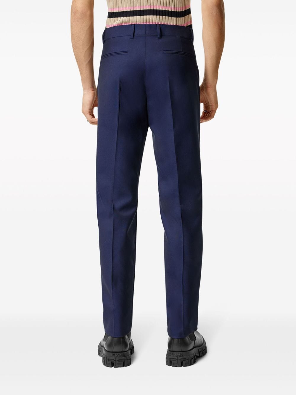 Shop Versace Pressed-crease Tapered-leg Trousers In Blue
