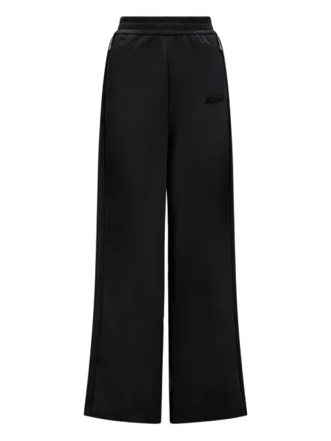 Moncler pants con rayas laterales en colaboración con adidas