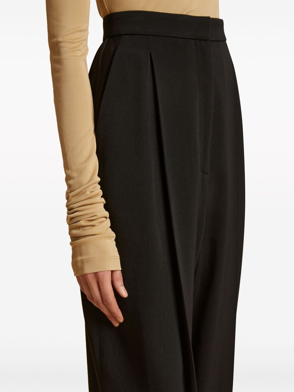Shop Khaite Ashford Pleated High-waisted Trousers In Black
