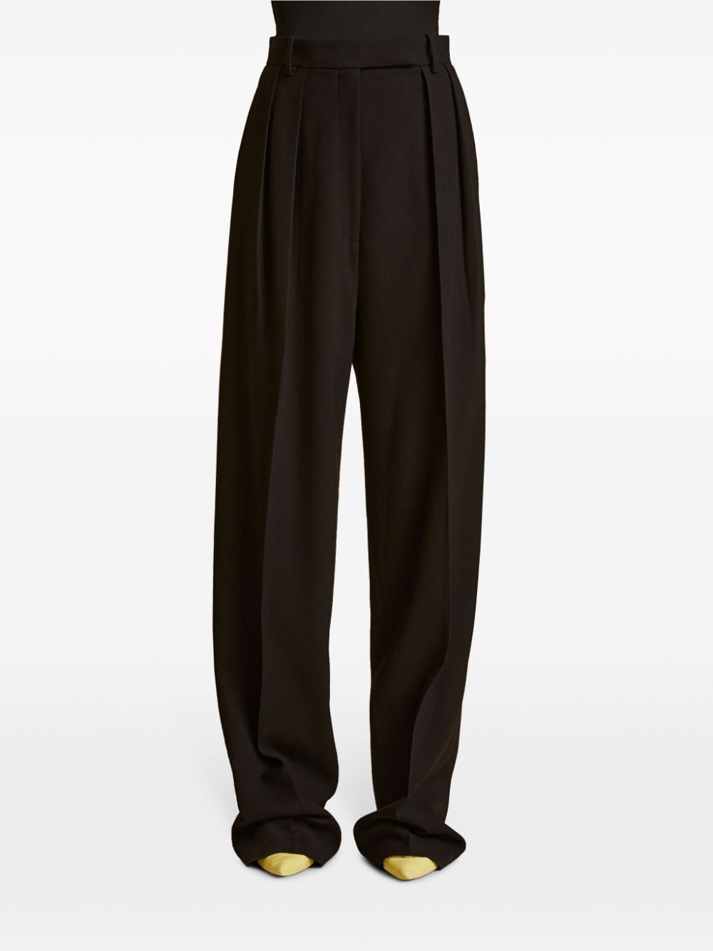 Shop Khaite Cessie Pleated High-waisted Trousers In Black