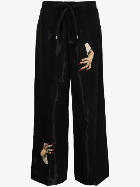 Undercover pantalones manos bordadas