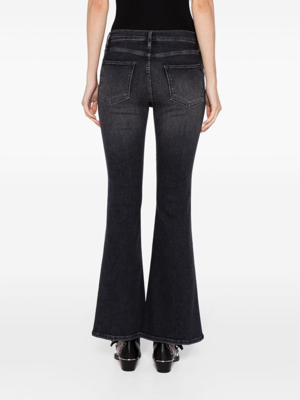 Shop Frame Le Pixie Flared Jeans In Black