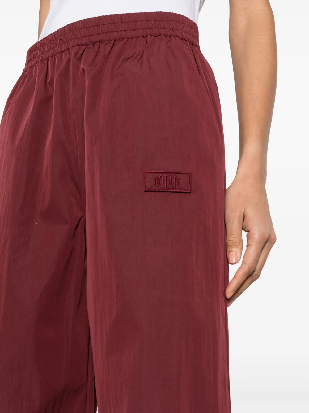 Shop Rotate Birger Christensen Logo-embroidered Elasticated-waist Palazzo Trousers In Red