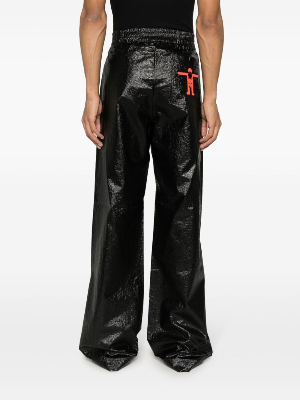 Shop Walter Van Beirendonck Embroidered-logo Trousers In Black