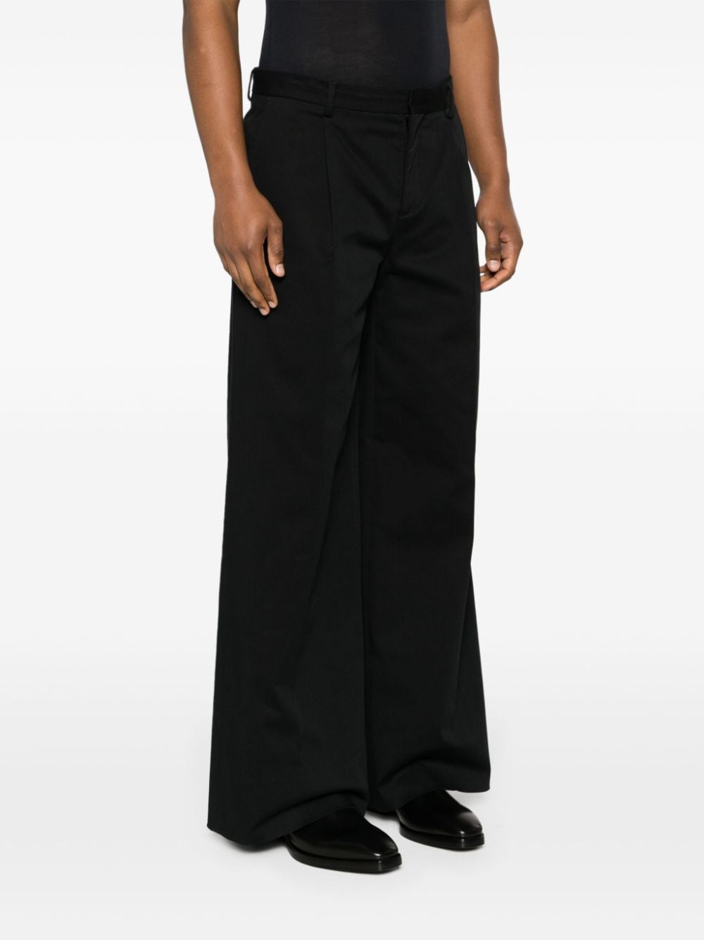 Shop Moschino Pleat-detailing Wide-leg Trousers In Black