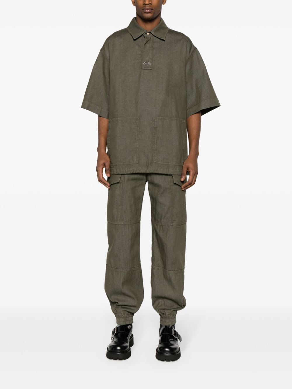 Shop Alexander Mcqueen Panelled-design Cotton Cargo Trousers In Grün