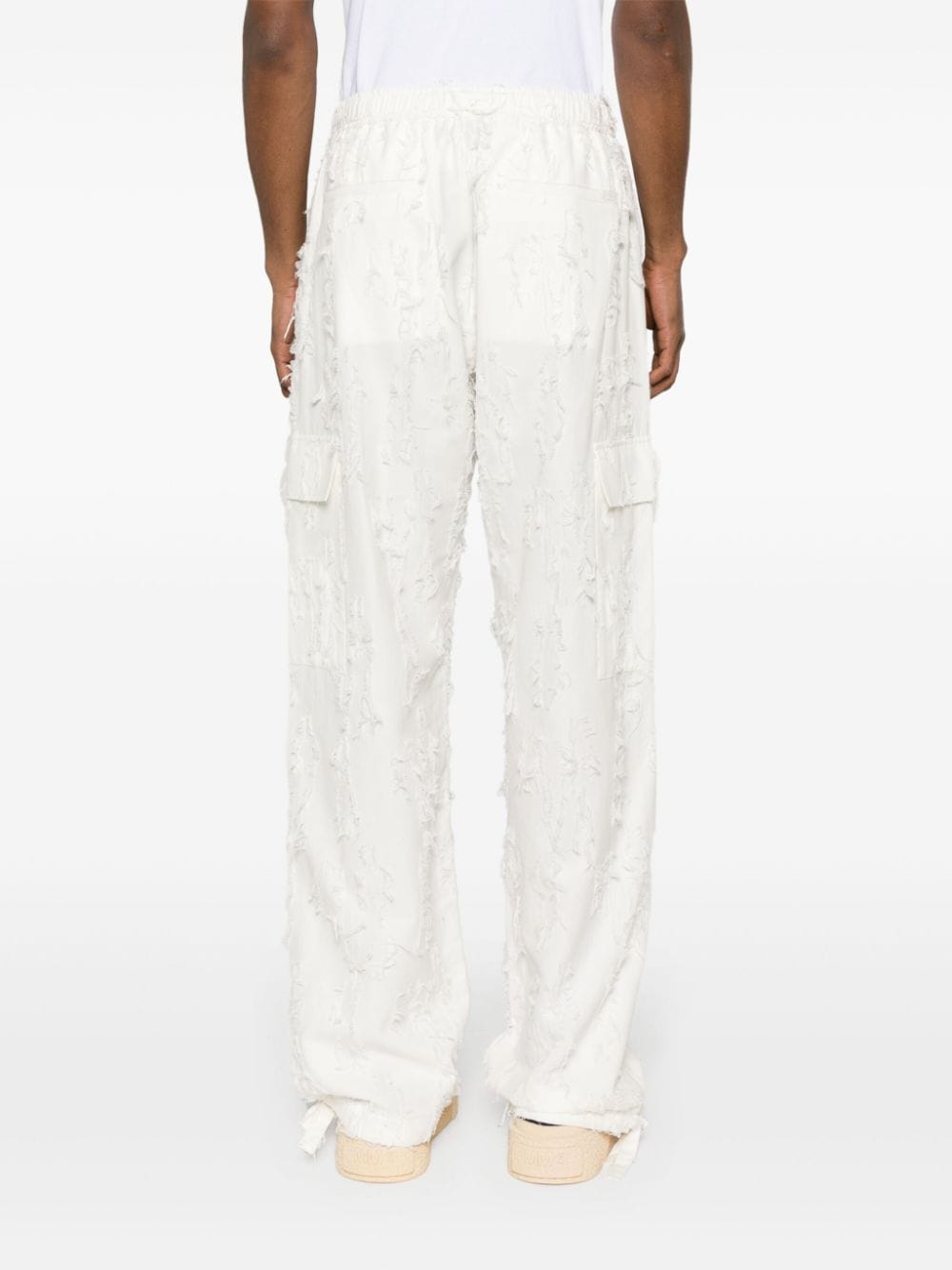 Shop Msgm Distressed-effect Cotton Trousers In White