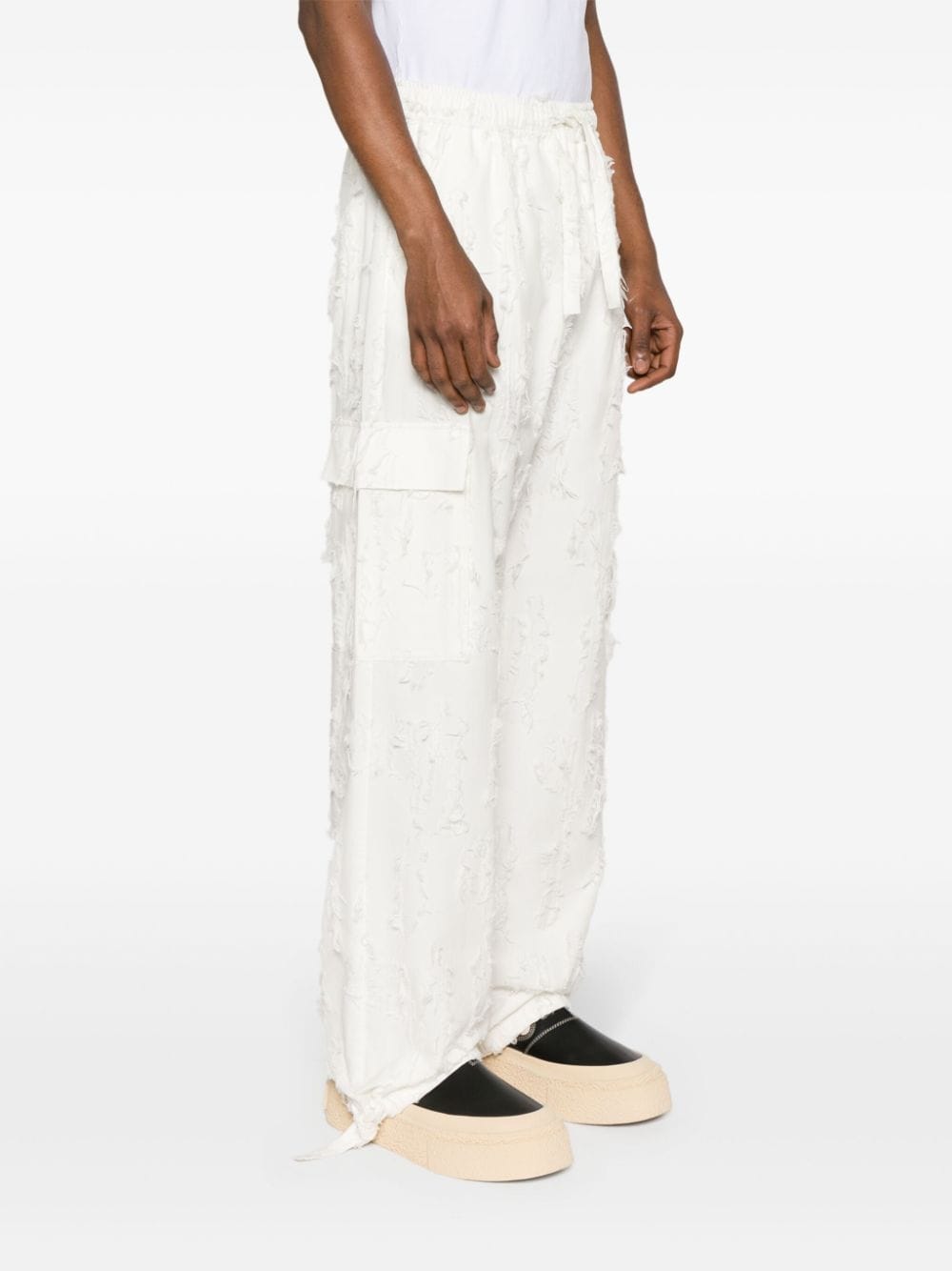 Shop Msgm Distressed-effect Cotton Trousers In White