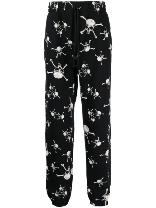 Pantalon de jogging en coton à imprimé tête de mort - SAINT MXXXXXX - Modalova