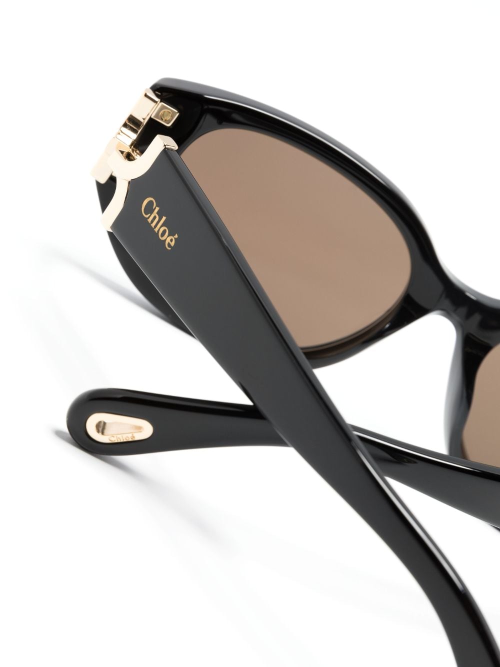 Chloé Eyewear Zonnebril met rond montuur en logo Zwart