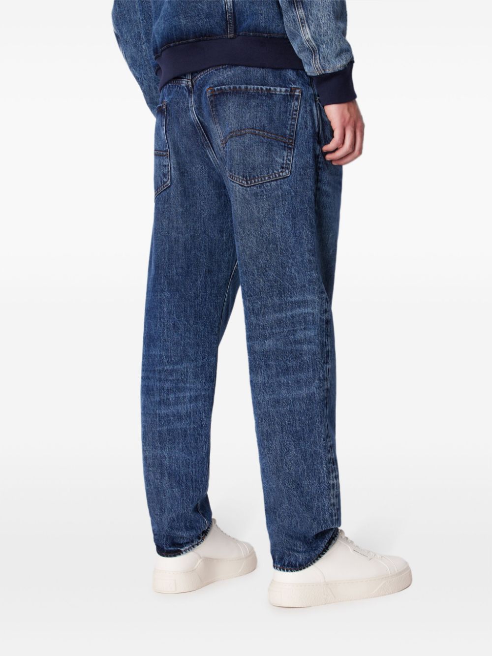 Shop Armani Exchange Whiskered Tapered-leg Jeans In Blue