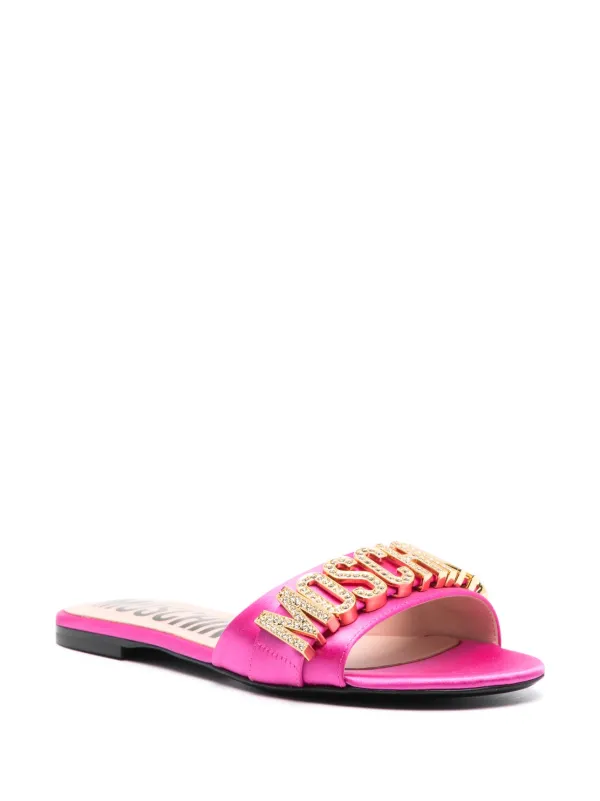 Moschino crystal embellished logo plaque Sandals Farfetch