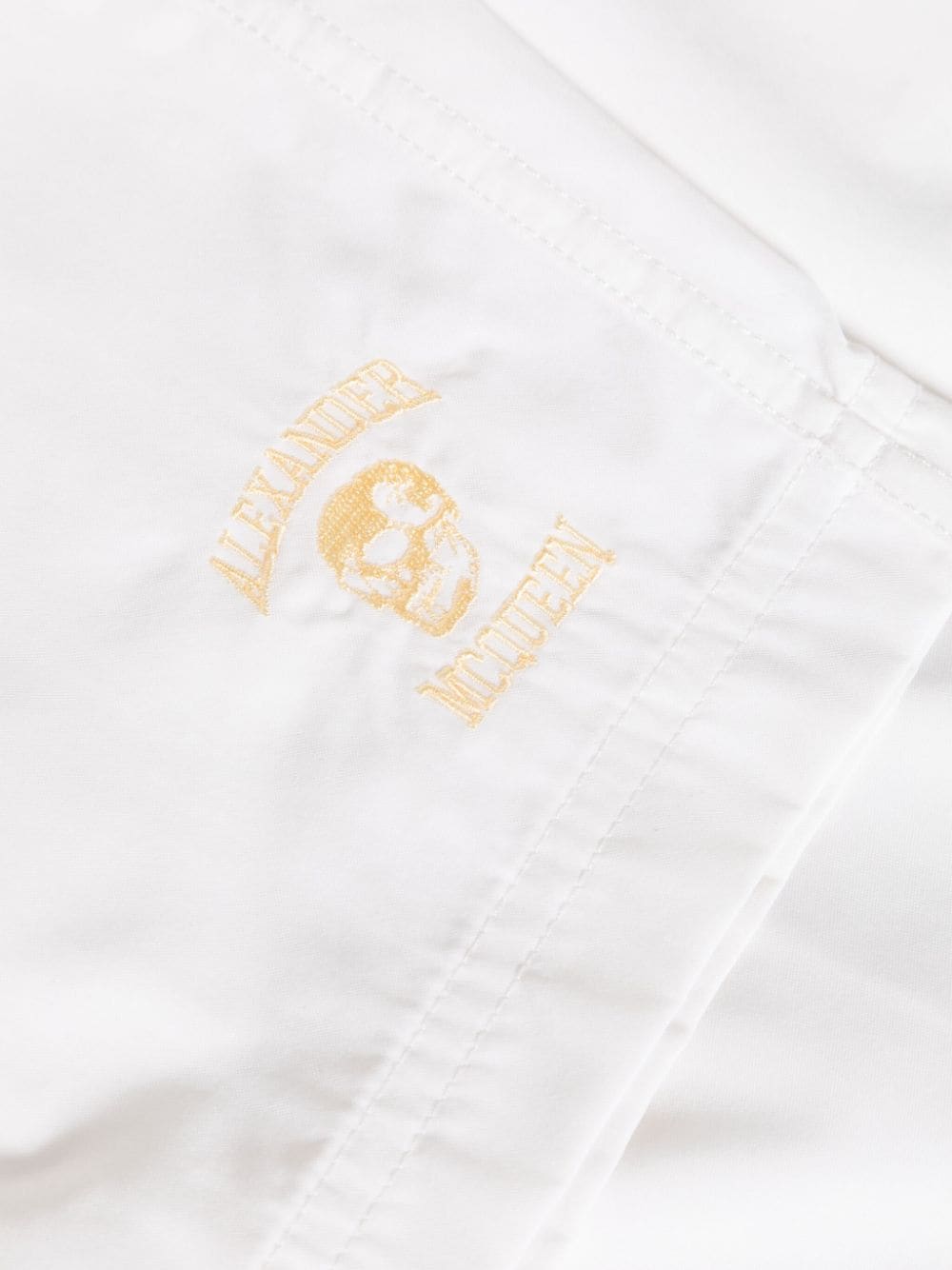 Shop Alexander Mcqueen Logo-embroidered Swim Shorts In Weiss