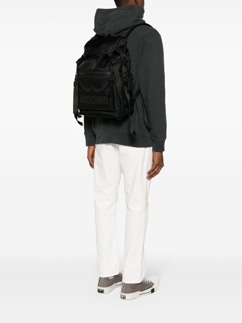 Shop Moschino Logo-appliqué Backpack In Black