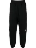 izzue logo-appliqué tapered-leg track pants - Black