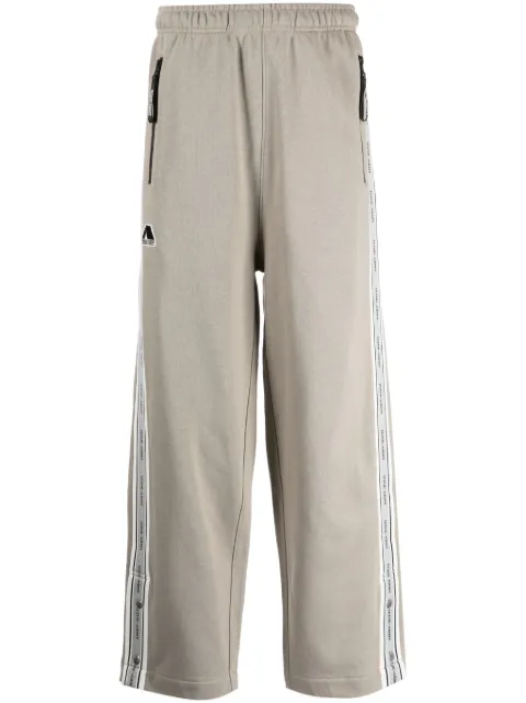 izzue pants con parche del logo
