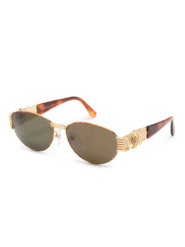 Fendi Pre Owned logo engraved oval frame Sunglasses Farfetch