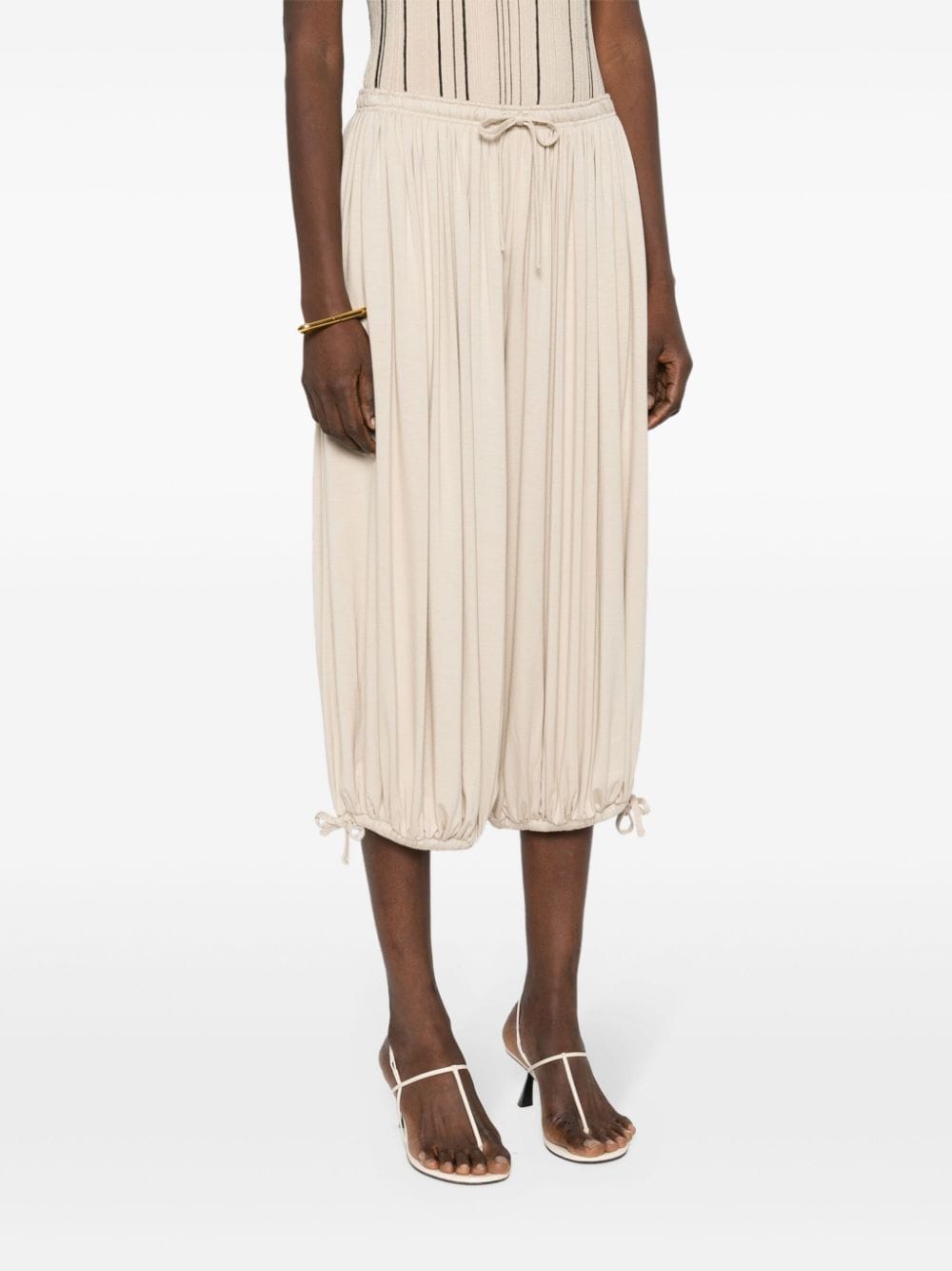 Shop Totême Gathered Jersey Trousers In Neutrals