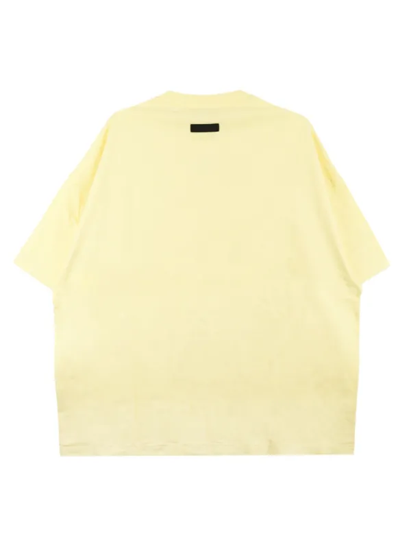 FEAR OF GOD ESSENTIALS ロゴ Tシャツ | イエロー | FARFETCH JP