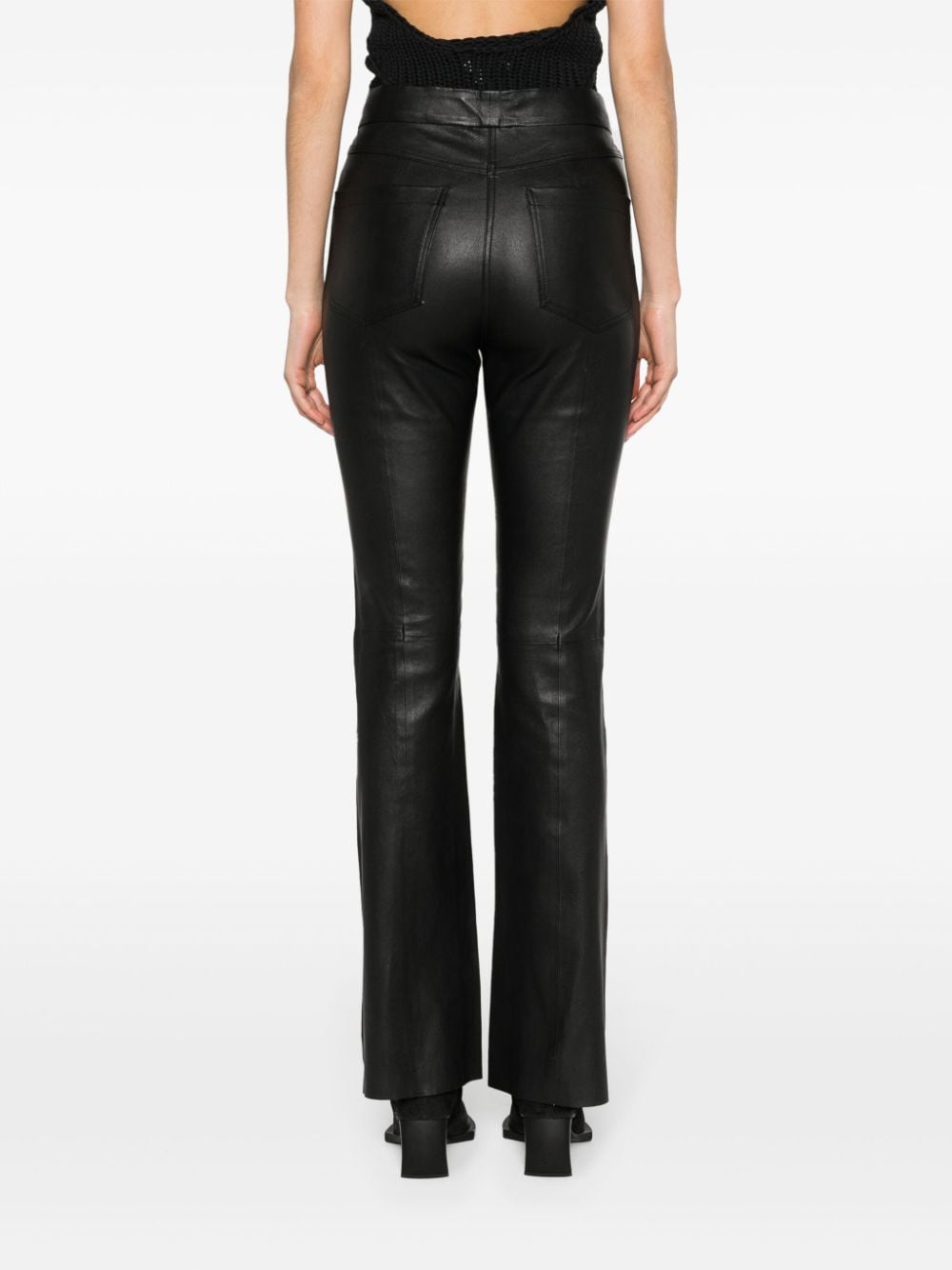 Shop Remain Flared Leather Trousers In Black