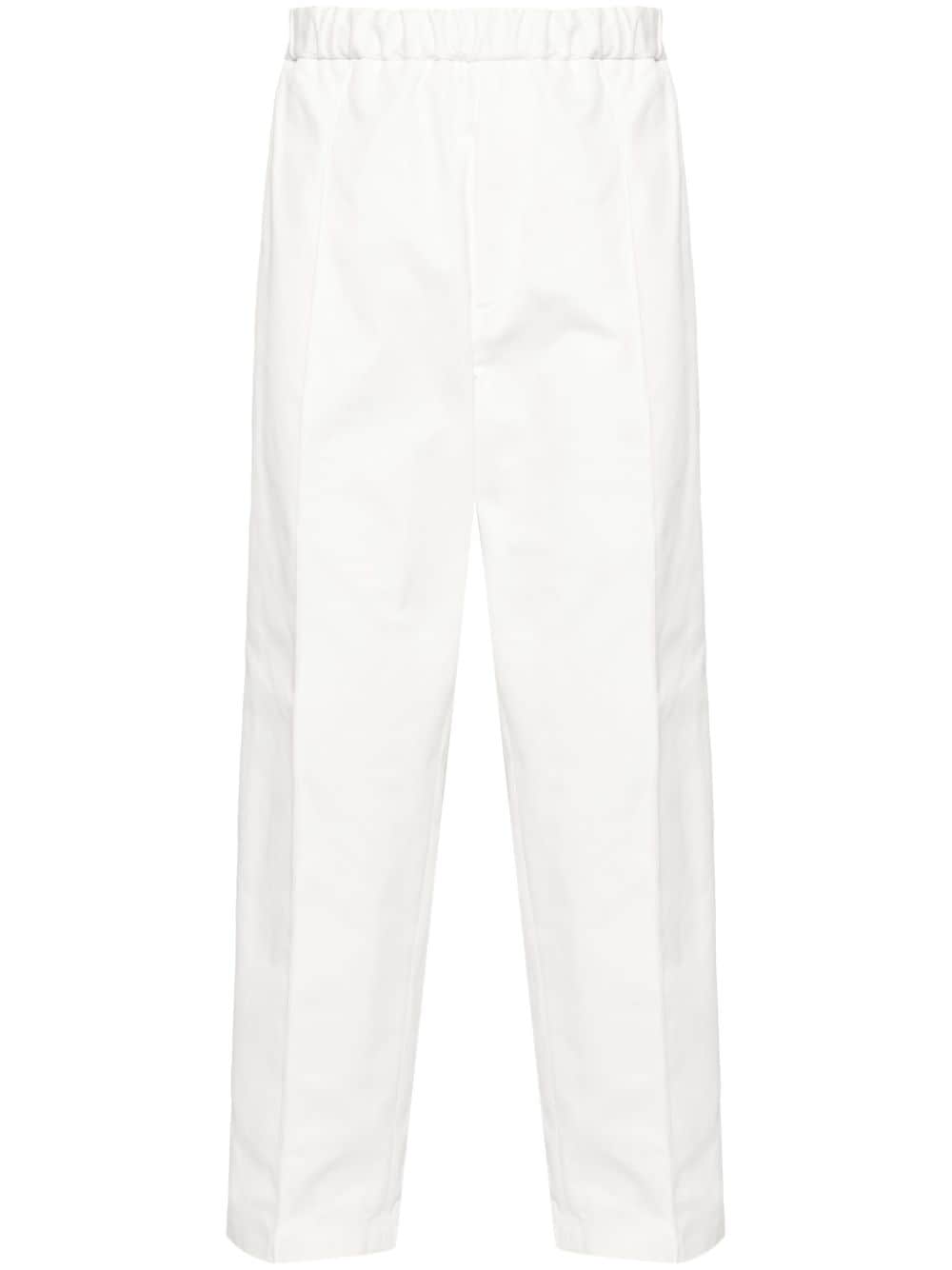 Shop Jil Sander Tapered-leg Cotton Trousers In 白色