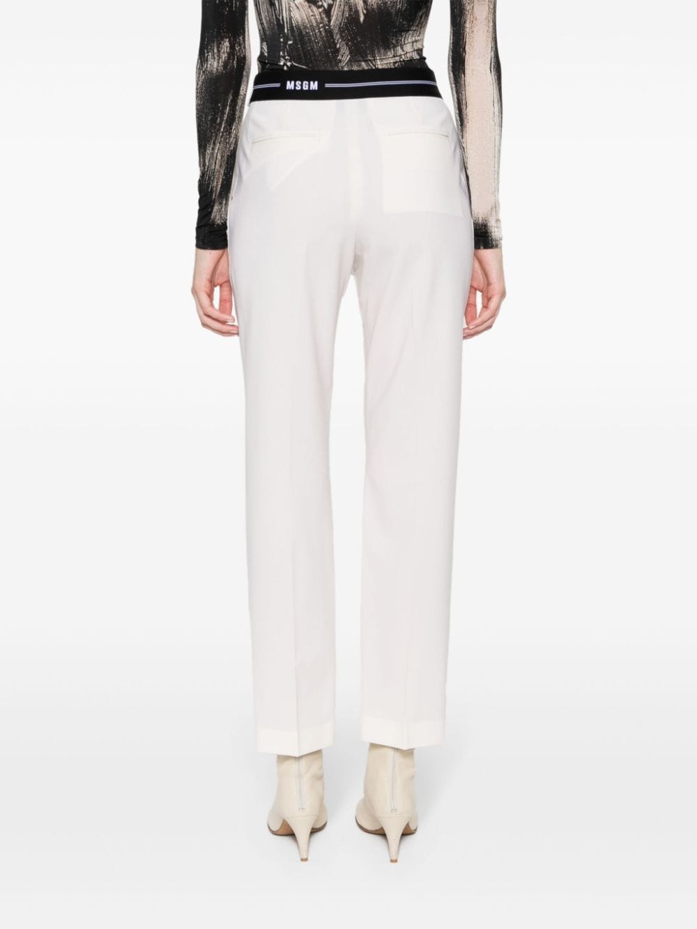 Shop Msgm Logo-waistband Tapered Trousers In Neutrals