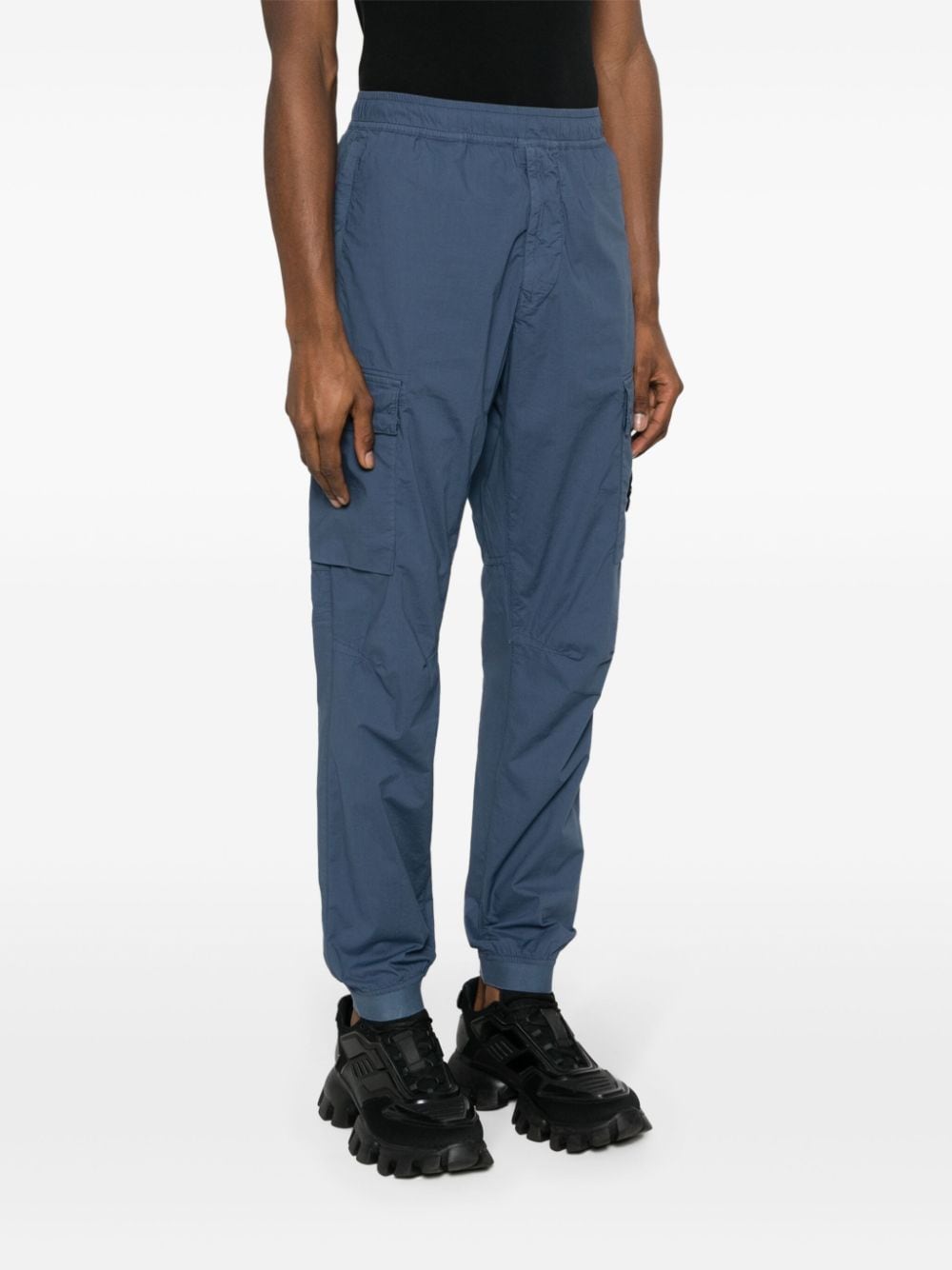 Shop Stone Island Compass-appliqué Tapered Cargo Trousers In Blue