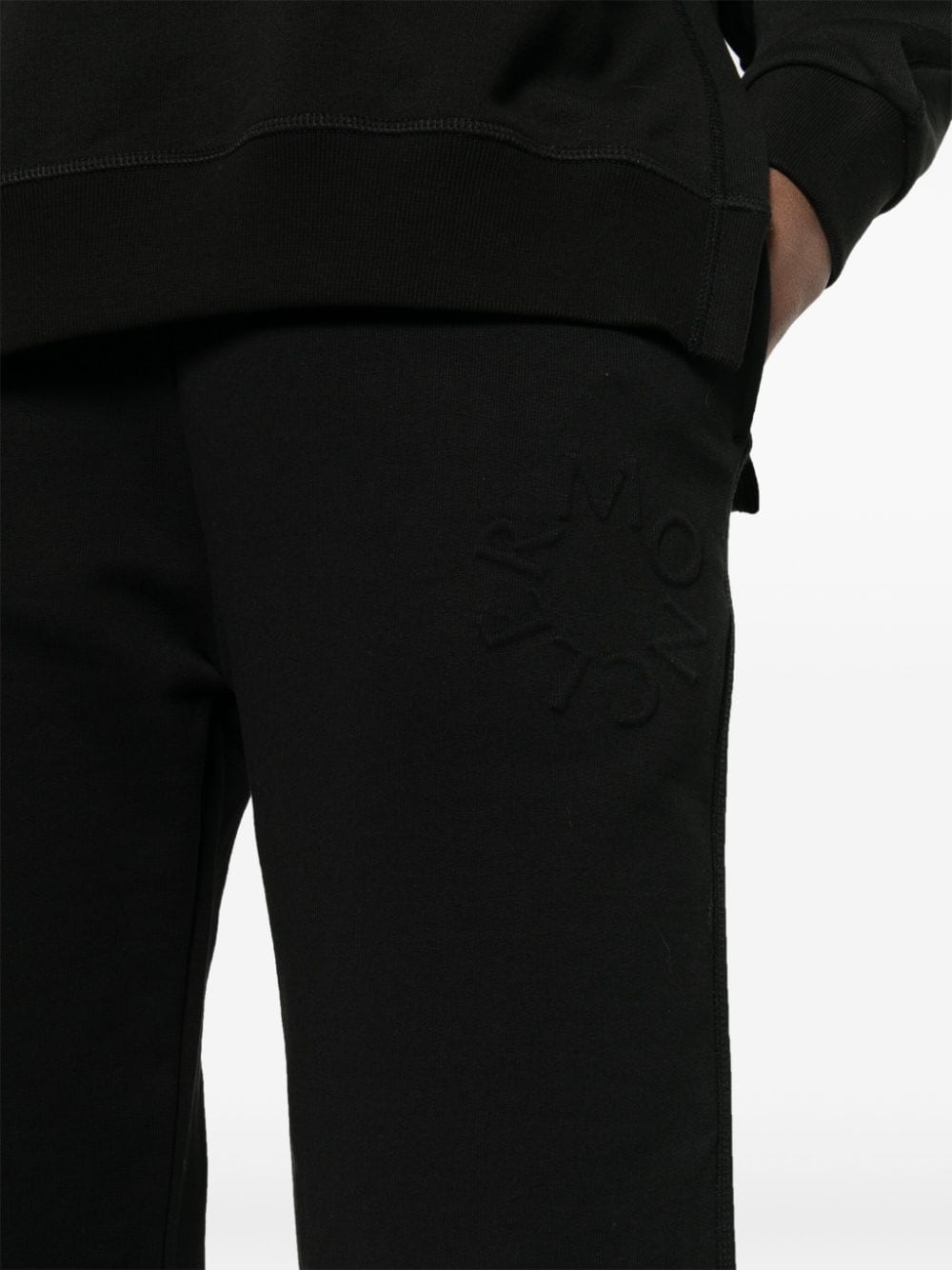 Shop Moncler Embossed-logo Track Pants In Schwarz