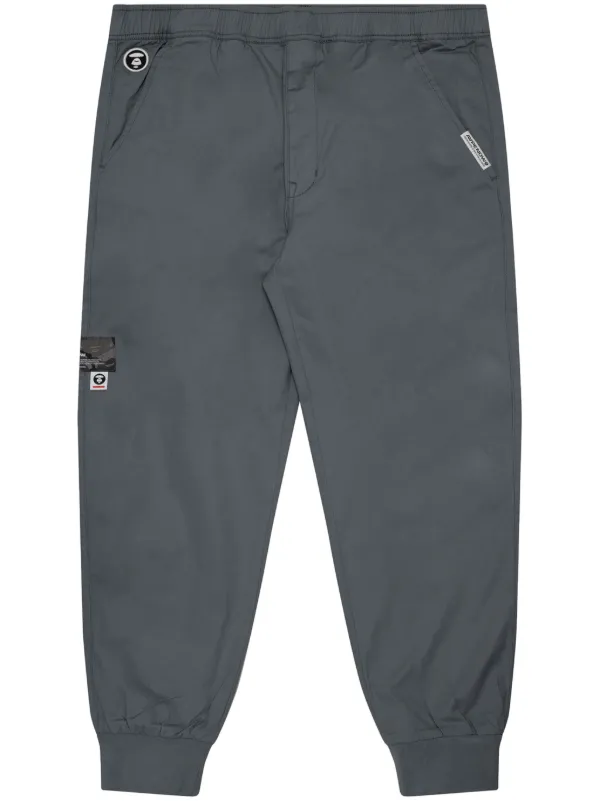AAPE BY *A BATHING APE® トラックパンツ AAPE BY *A BATHING APE® トラックパンツ | グレー | FARFETCH JP