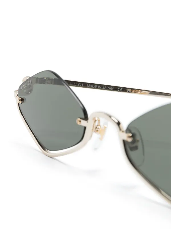 Gucci Eyewear geometric frame Sunglasses Gold FARFETCH AE