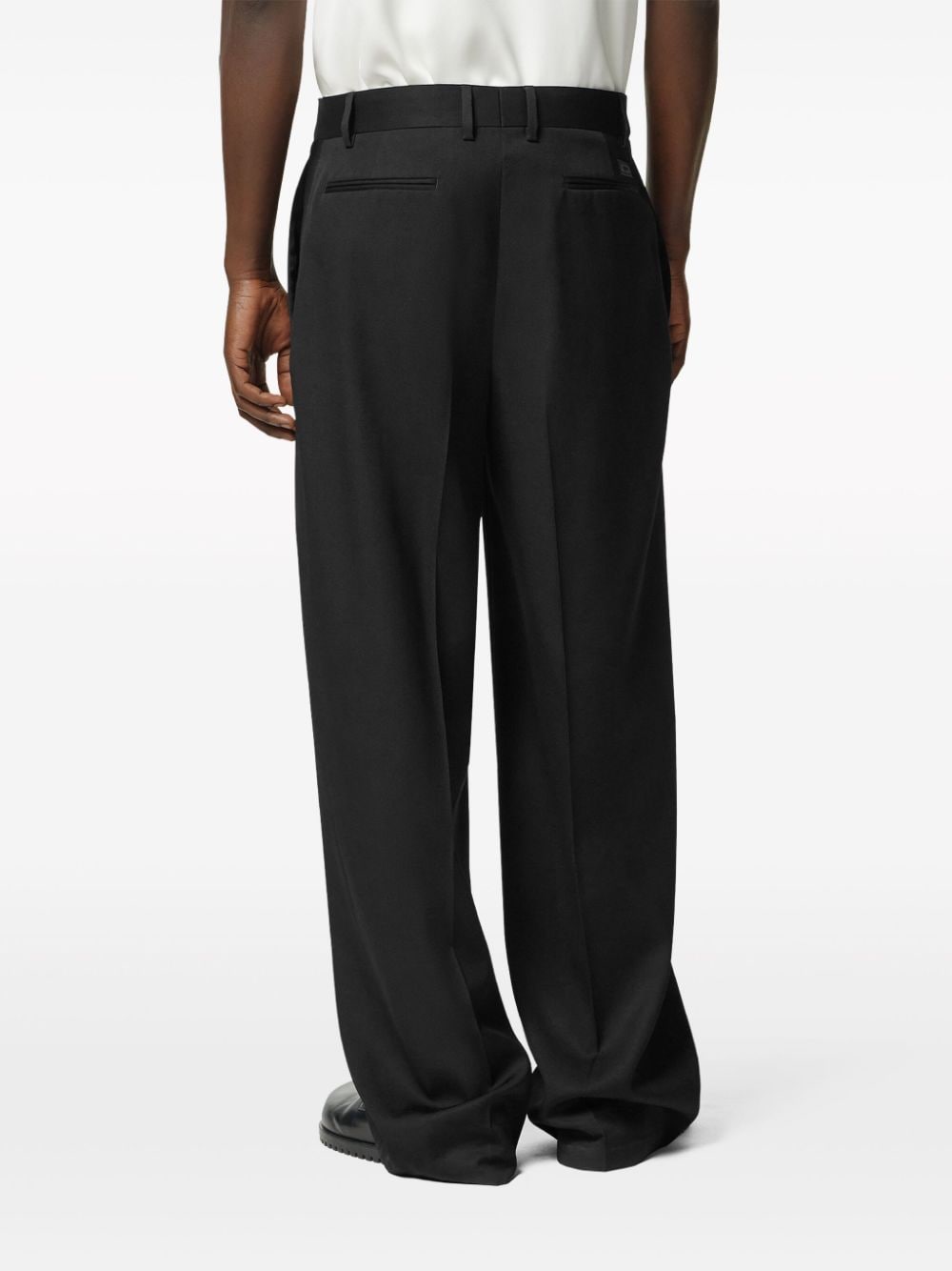 Shop Versace Wide-leg Virgin-wool Trousers In Black