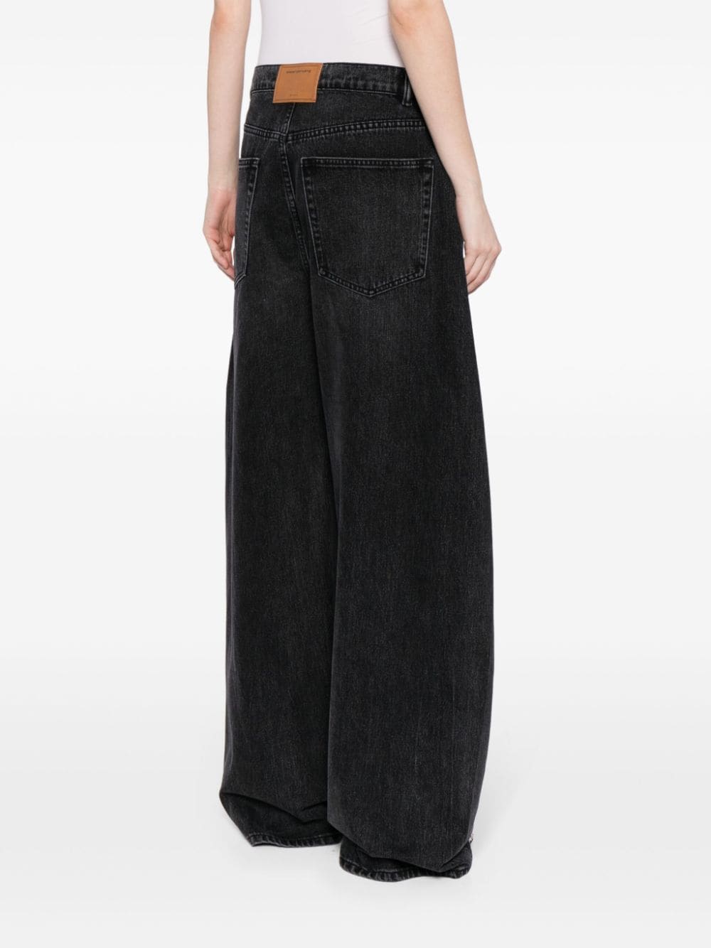 Shop Alexander Wang Low-rise Wide-leg Jeans In Black