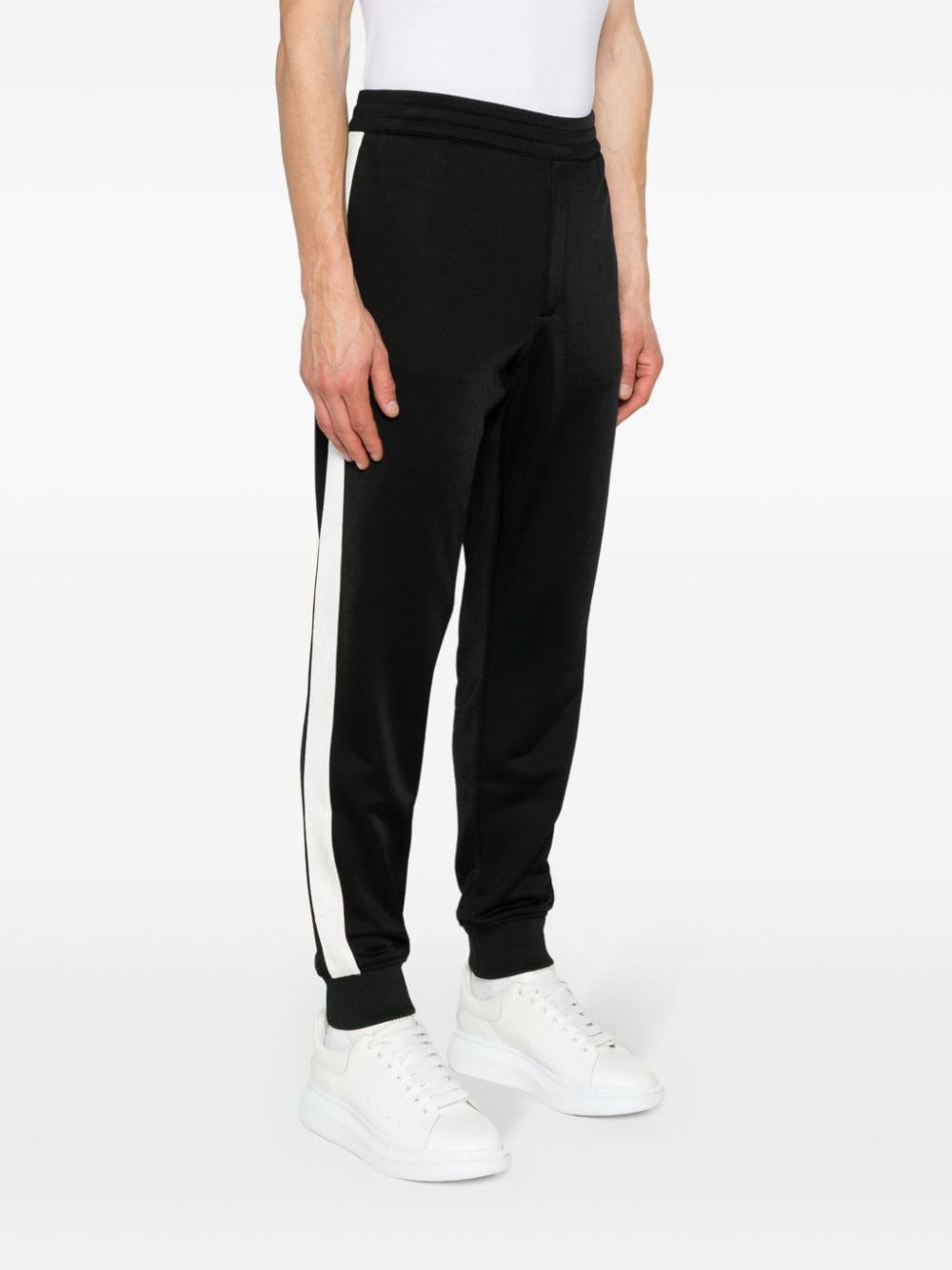 Shop Alexander Mcqueen Embroidered-logo Contrast-panel Track Pants In Black