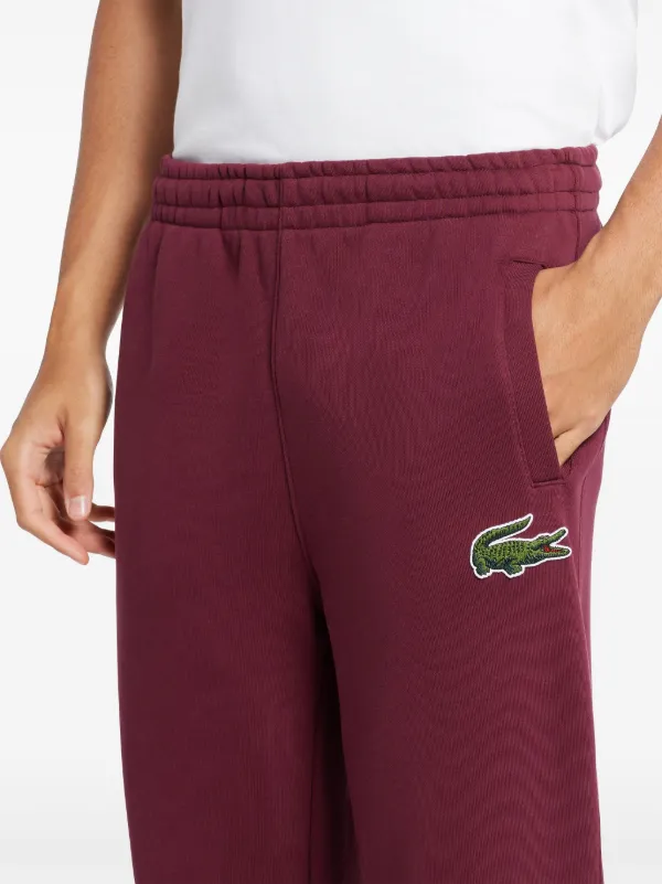 LACOSTE トラックパンツ　赤 Lacoste ロゴパッチ トラックパンツ | レッド | FARFETCH JP