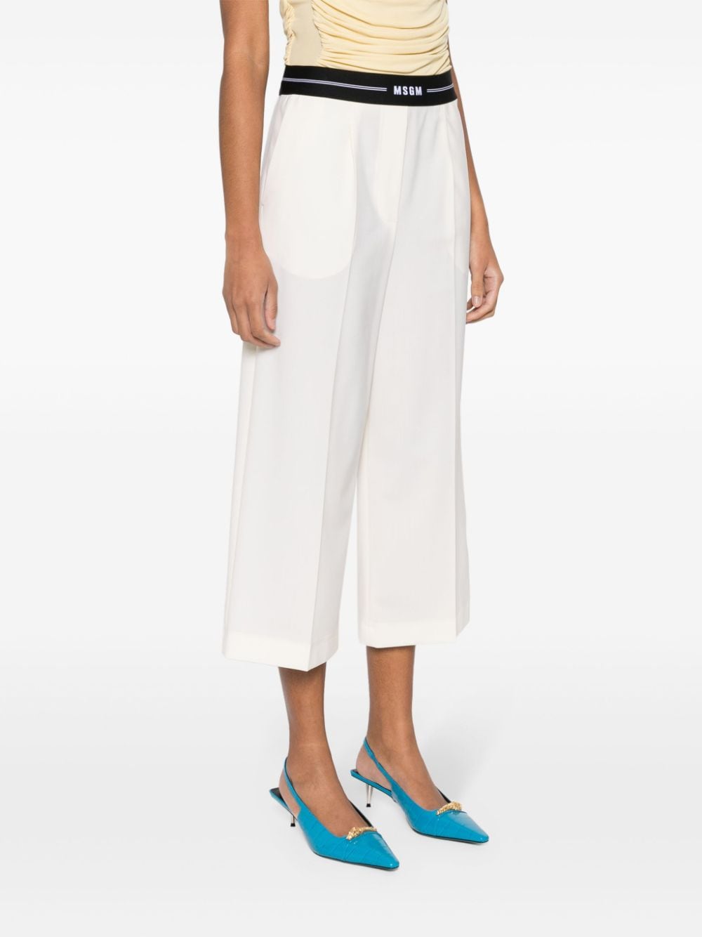 Shop Msgm Logo-waistband Cropped Trousers In Weiss