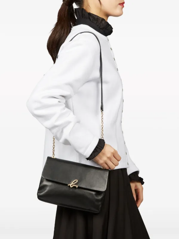 Agnès b. logo-clasp Leather Crossbody Bag | Black | FARFETCH