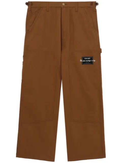 izzue logo-patch wide-leg trousers