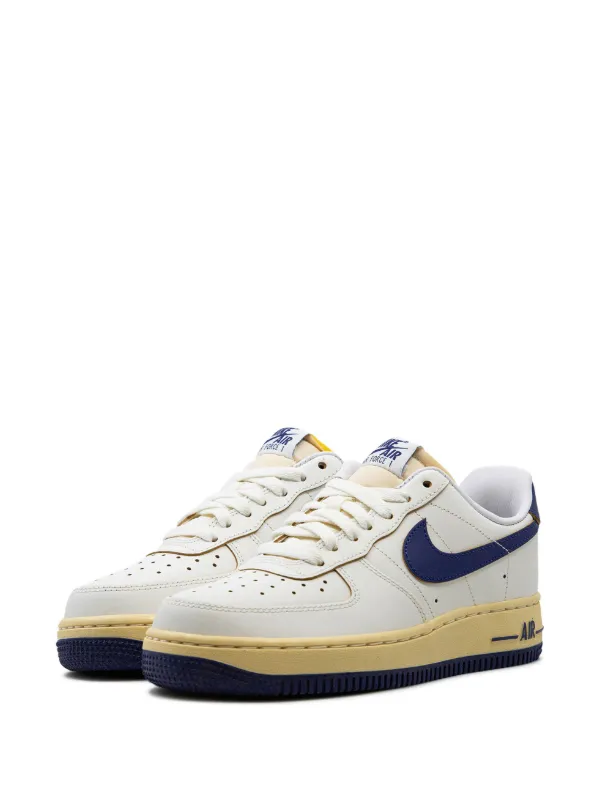 nike air force 1 sneakers with navy swoosh and gum sole