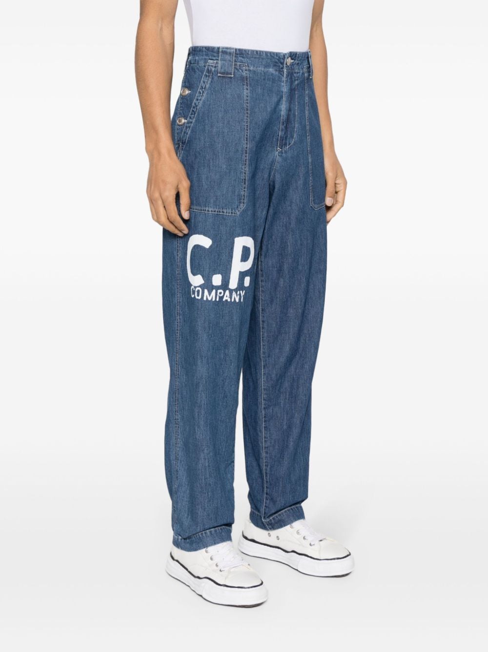 Shop C.p. Company Logo-print Tapered Jeans In 蓝色