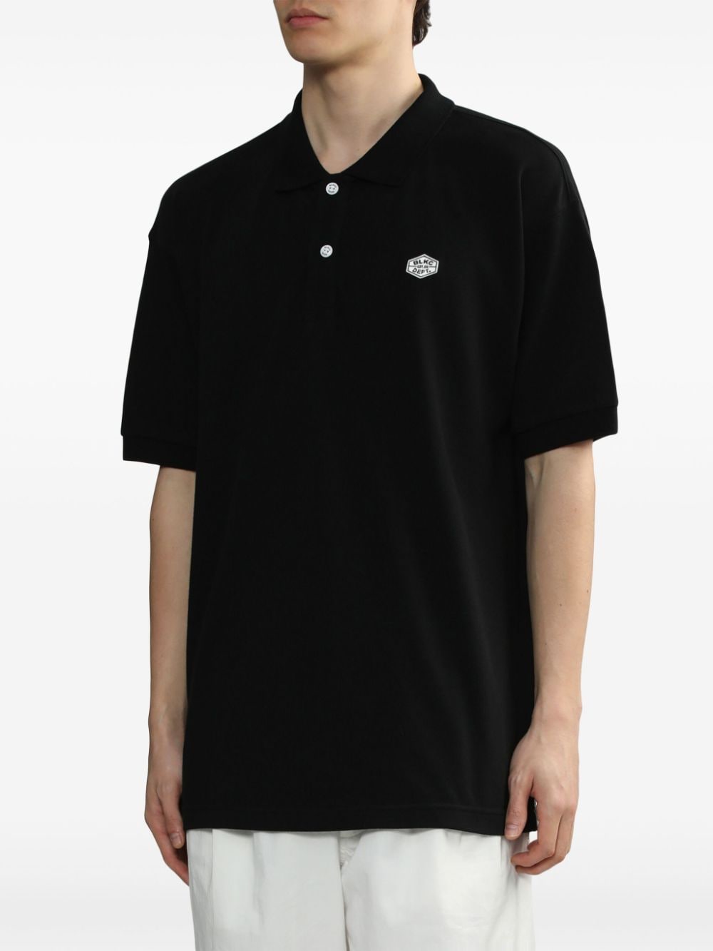 Shop Chocoolate Logo-appliqué Cotton Polo Shirt In 黑色