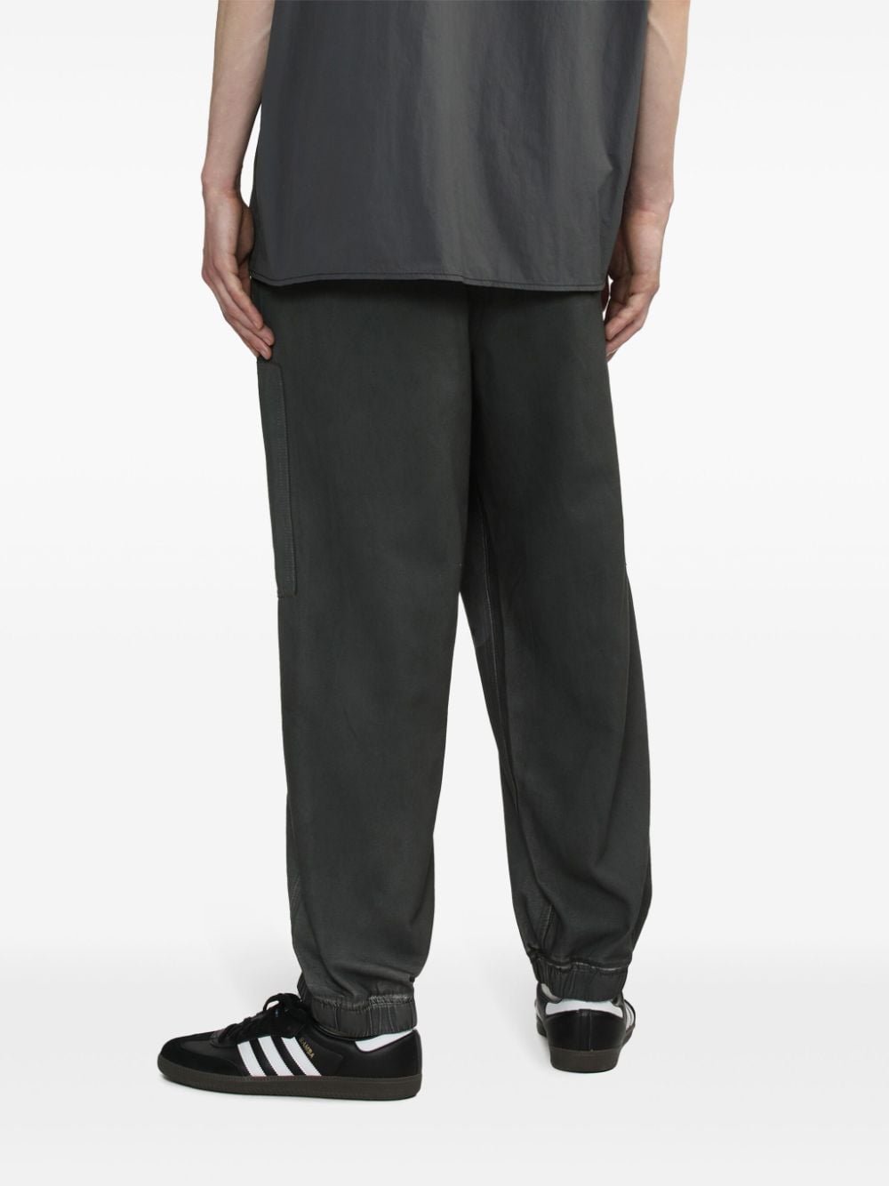 Shop Izzue Tapered Cotton Trousers In Black