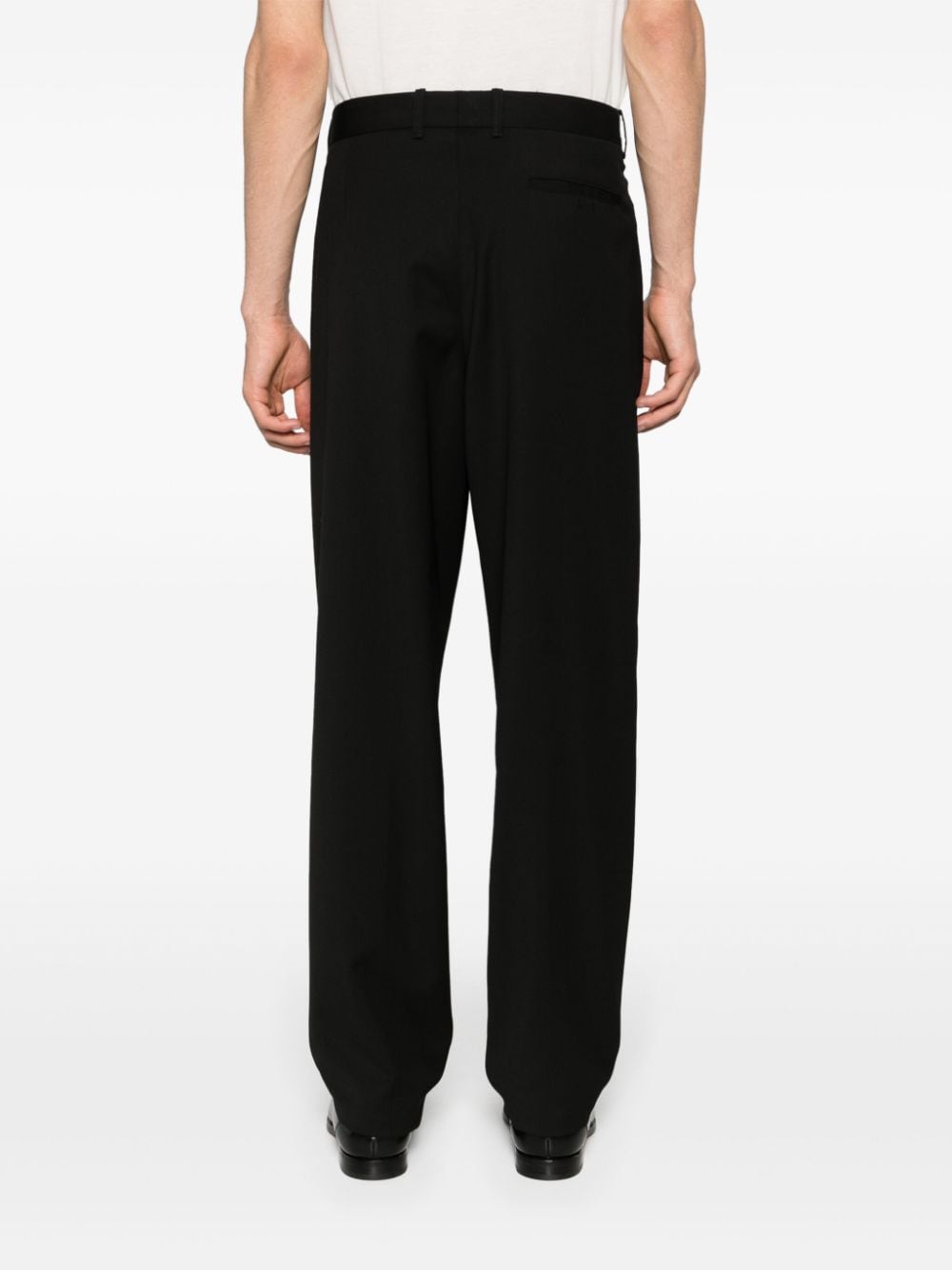 Shop Giorgio Armani Pleated Tapered Trousers In Schwarz