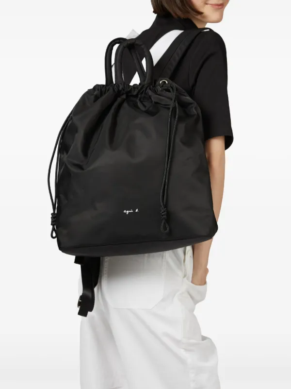 Agnès b. logo-print Drawstring Backpack | Black | FARFETCH