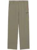 izzue logo-appliquéd trousers - Green